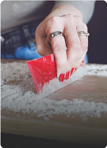 Wiping the counter with the flat spoon