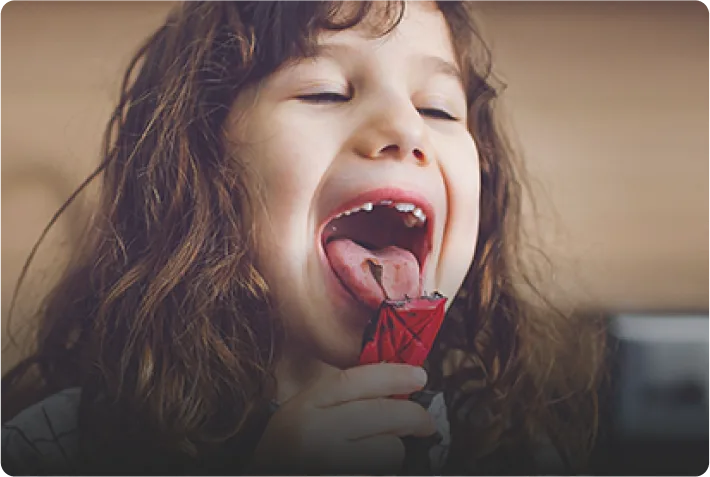 A child licking the spoon