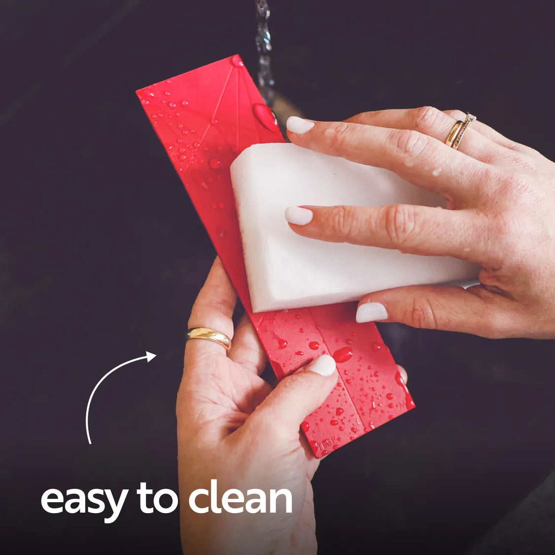 Rinsing the flat spoon under a tap